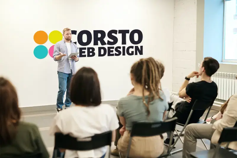 Corsto presenting as a key speaker at a business improvement event.