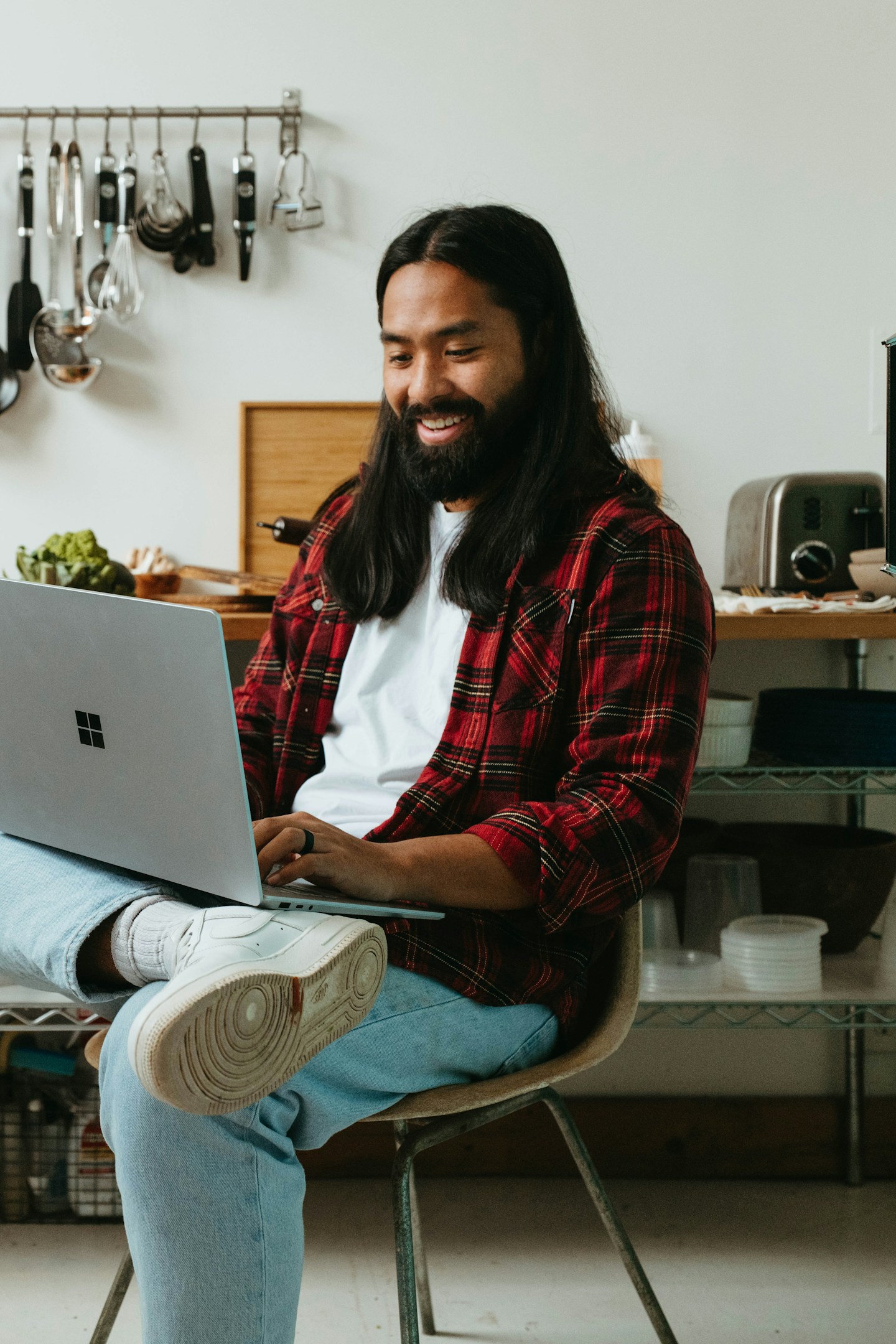A business owner reviewing website launch plans on a laptop.