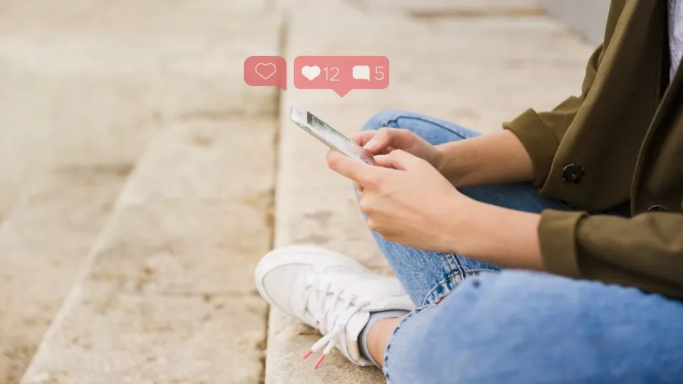 Person using social media on a mobile phone.